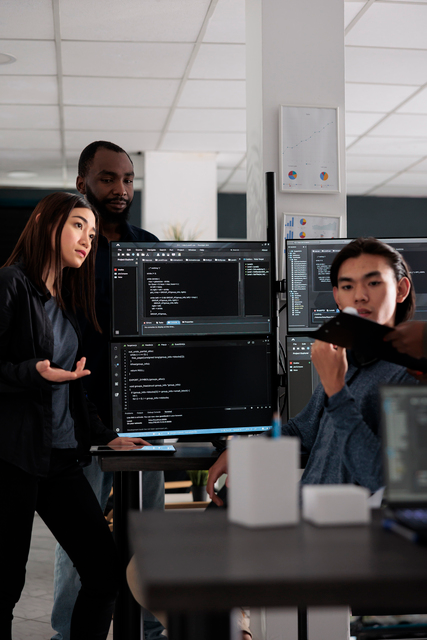 Support engineers reviewing code together