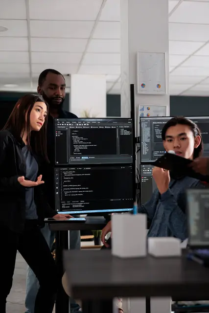 Support engineers reviewing code together